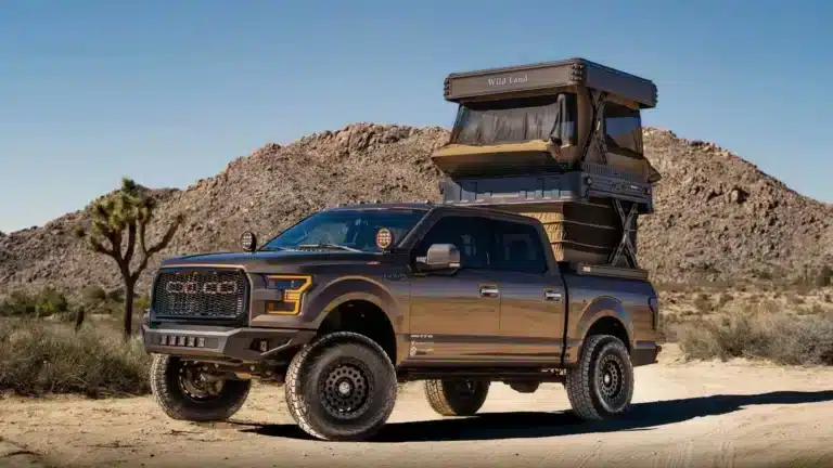 Cinch x Wild Land Wingman two-storey rooftop tent deployed on a Ford F-150 at a desert campsite