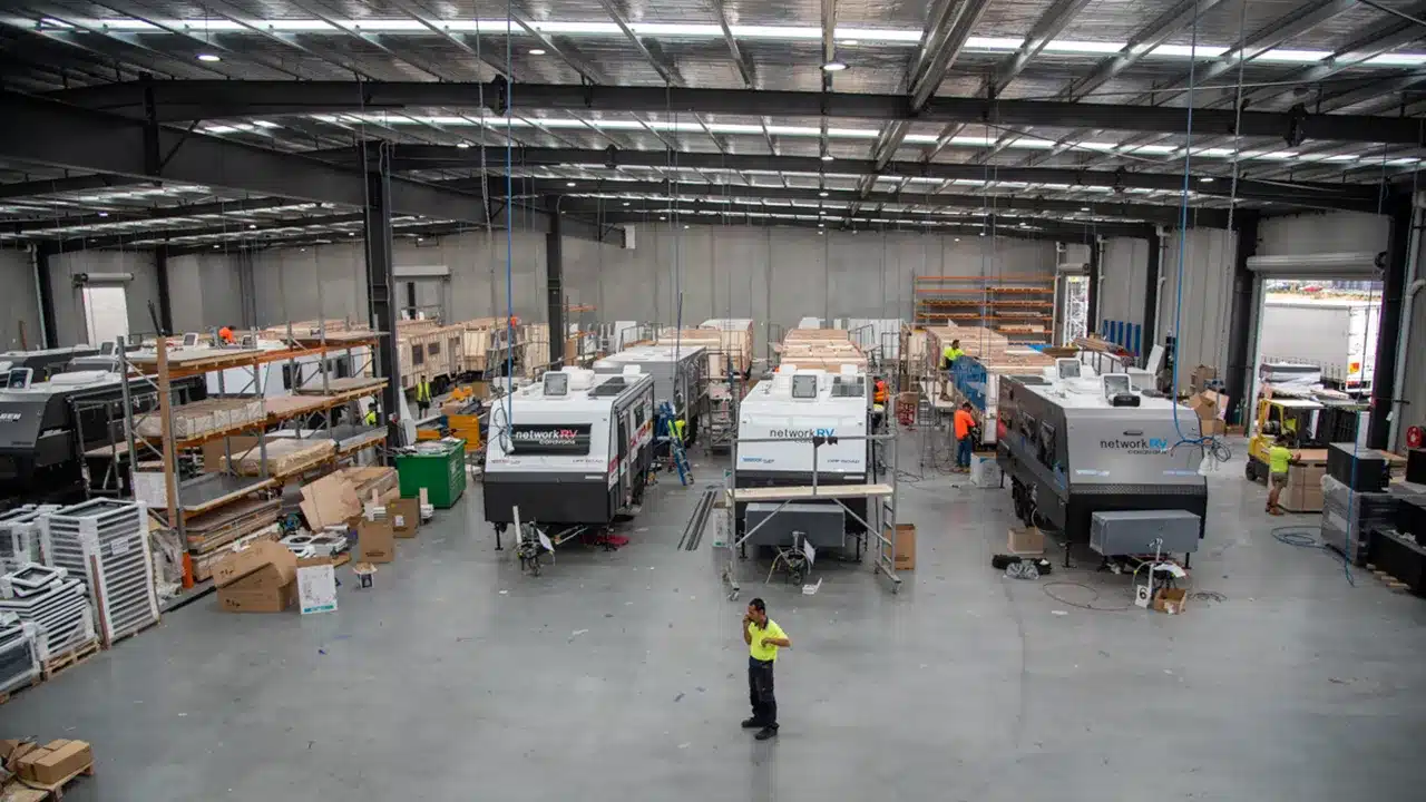 Network RV caravans under construction on the production line inside a Melbourne manufacturing facility