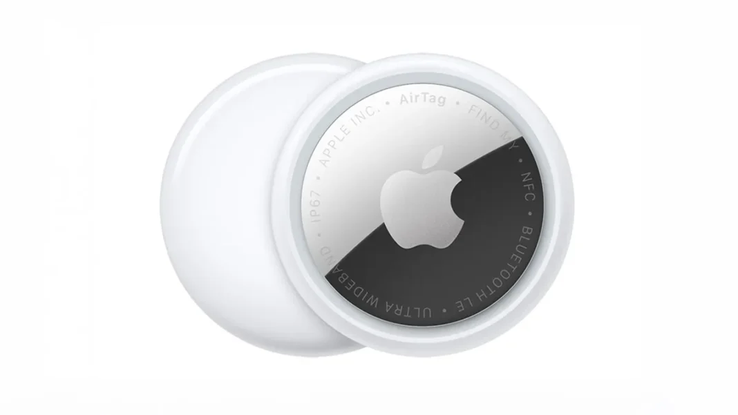 Two Apple AirTags on a white background showing the white plastic face and polished steel back