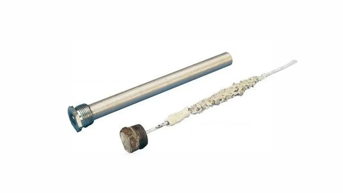 New caravan hot water anode rod beside a heavily corroded used rod worn down to the core wire