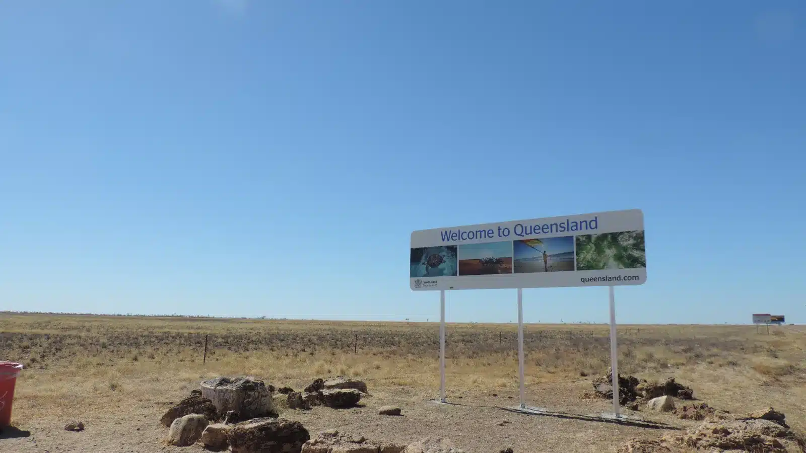 Welcome to Queensland sign on the Barkly Highway at the Northern Territory border near Camooweal