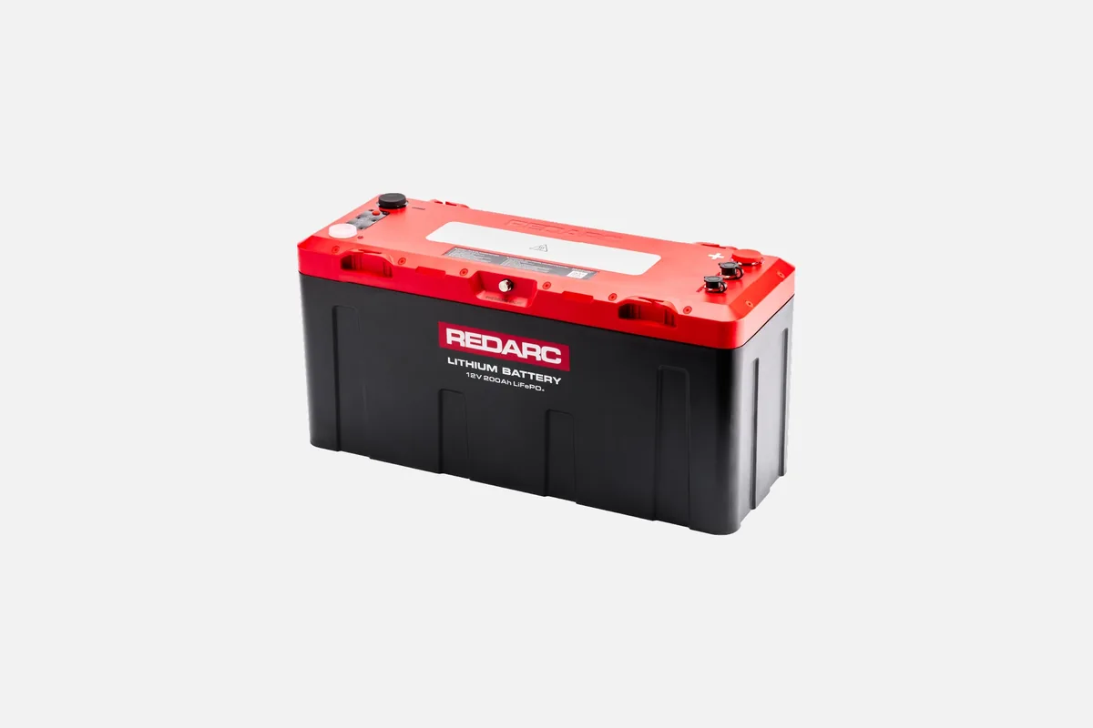 REDARC 200Ah lithium battery with a red top and black case, on a light grey background